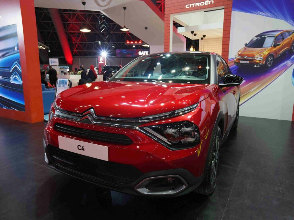 A red car on display at a car show